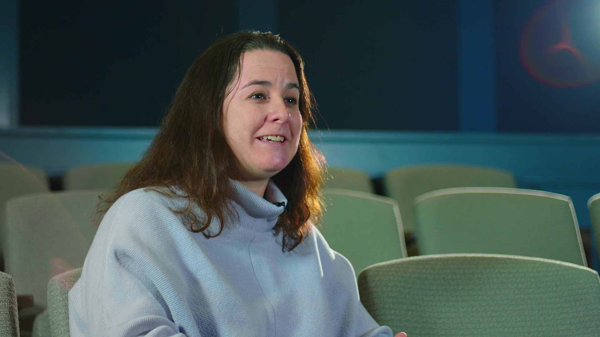 Elementary school teacher Beth Lycosky sits in the Alan B. Miller Theater and discusses what Washington's tent means to her and her students.