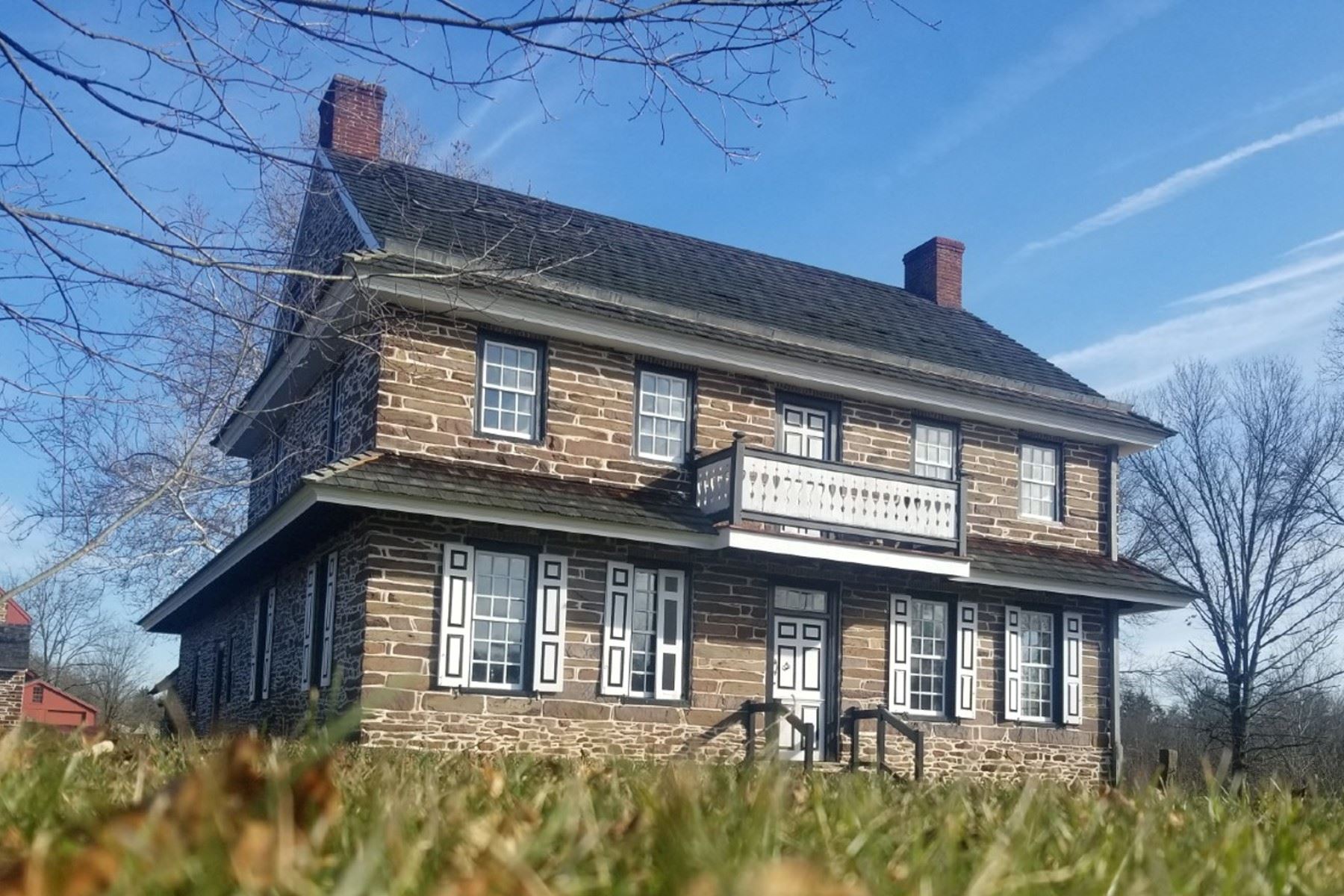 This image shows an old stone house that is the Peter Wentz Farmstead in Mongomery County Pennsylvania.