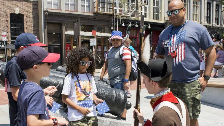Children with a reenactor during the summer