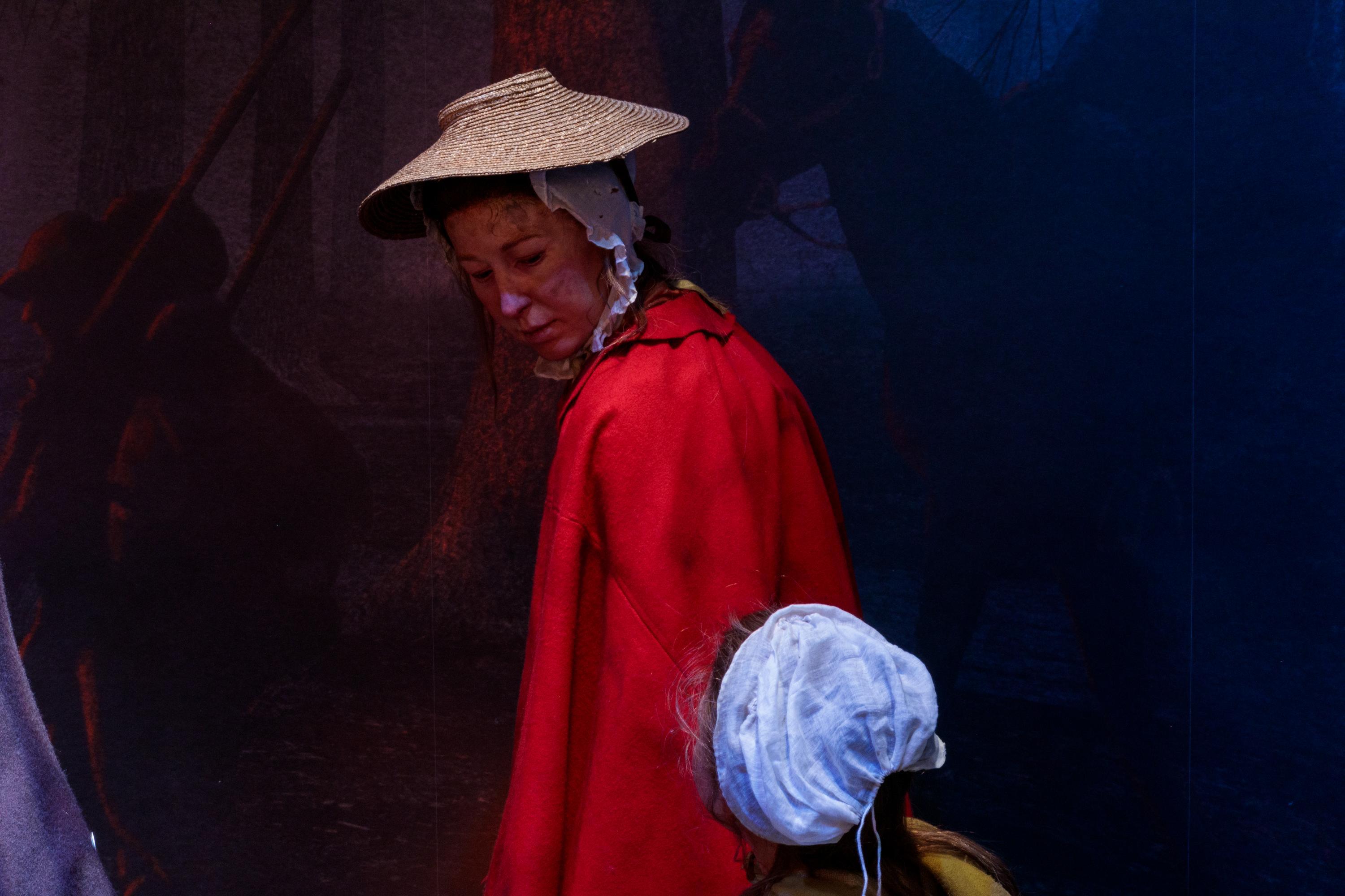 Lifelike figures of a woman and child in the Museum's galleries