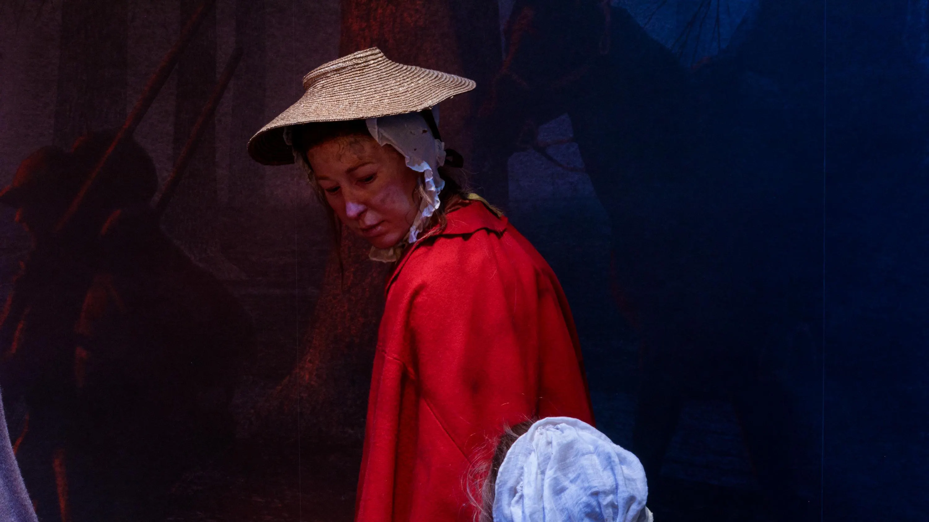 Lifelike figures of a woman and child in the Museum's galleries