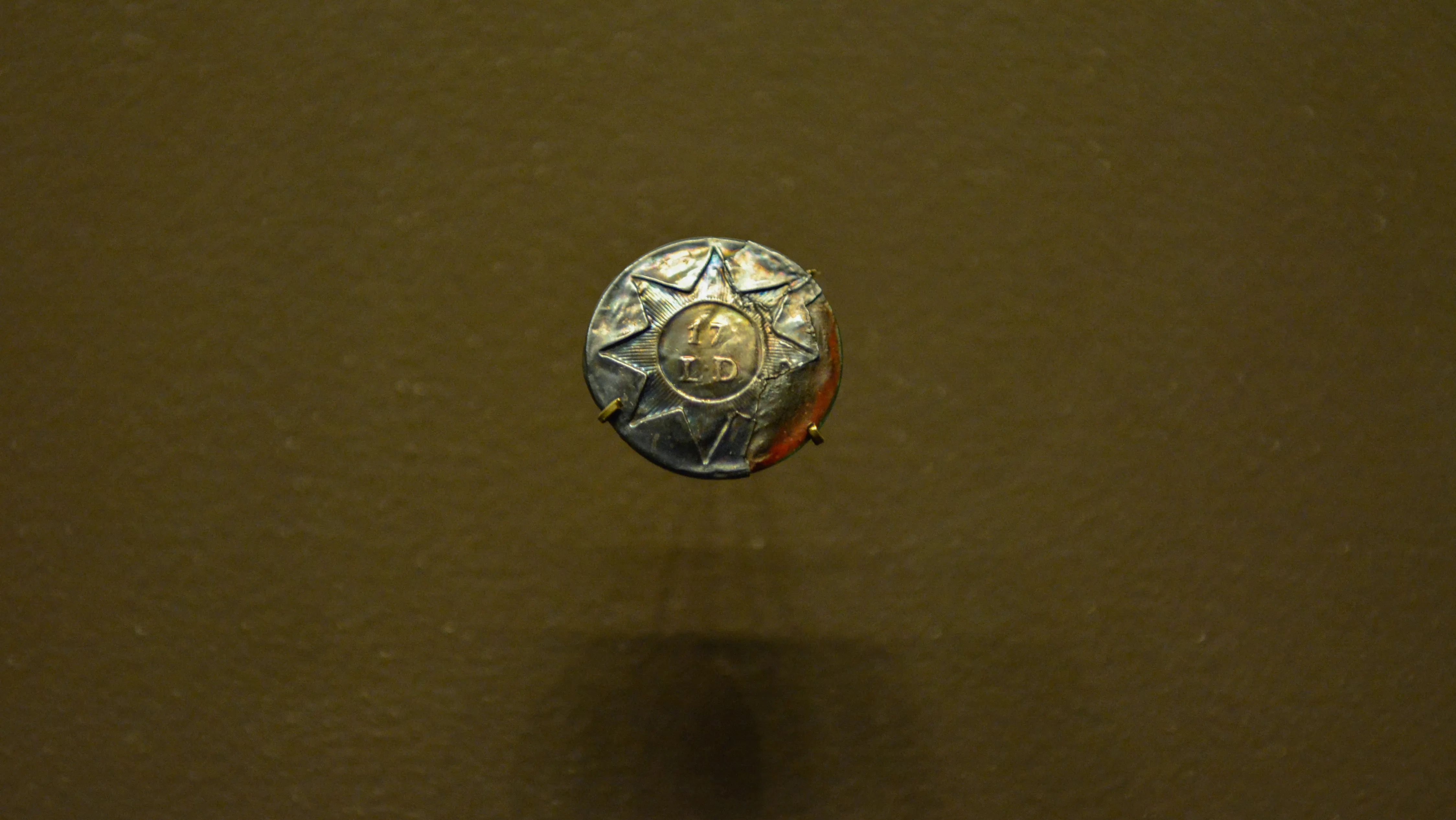 A button in a new display about the 2nd Spartan Regiment in the Museum's gallery on the war in the south.