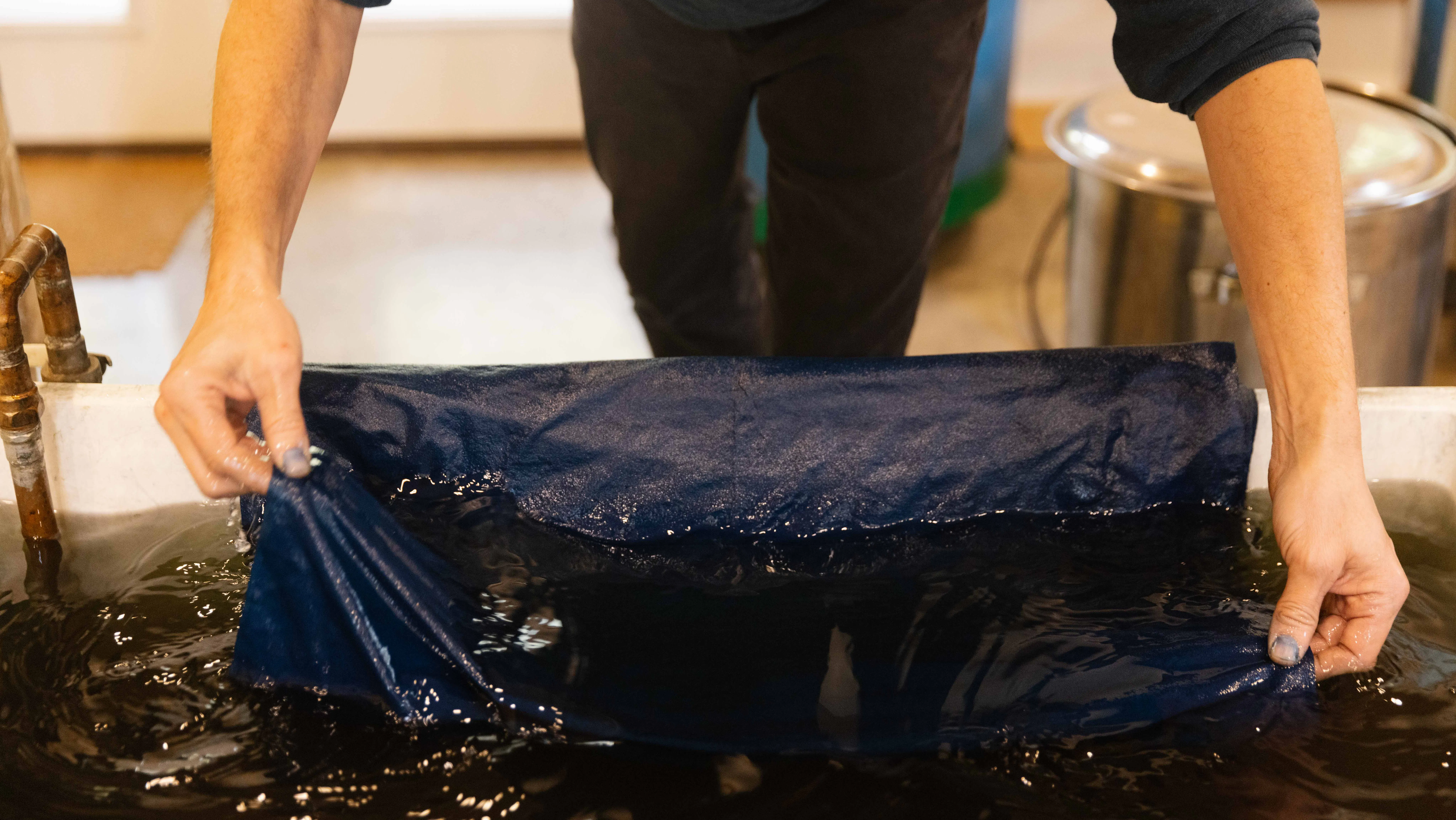 Rowland Ricketts dyes silk for the Museum's replica of Washington's Standard flag.