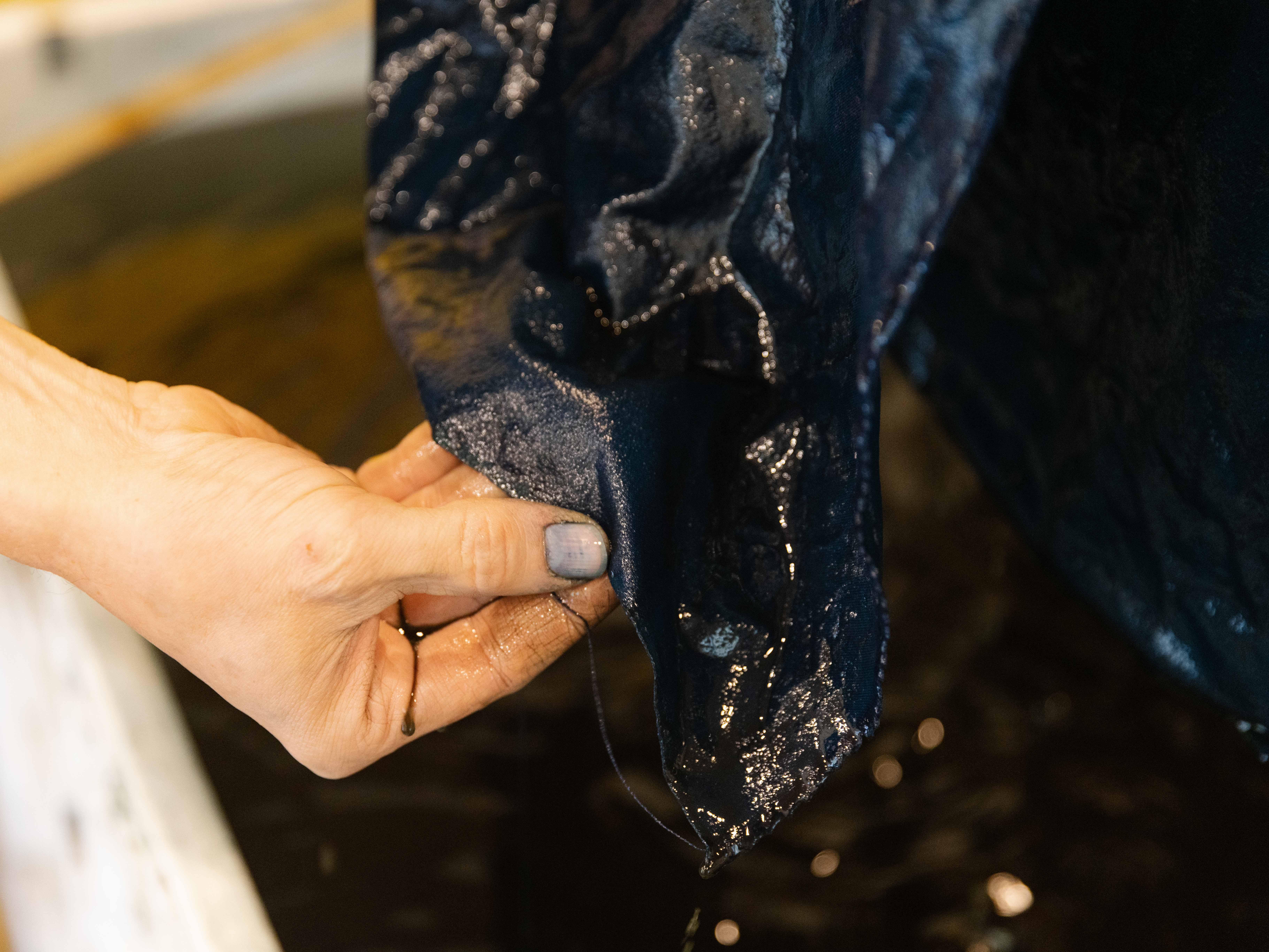Rowland Ricketts dyes silk for the Museum's replica of Washington's Standard flag.