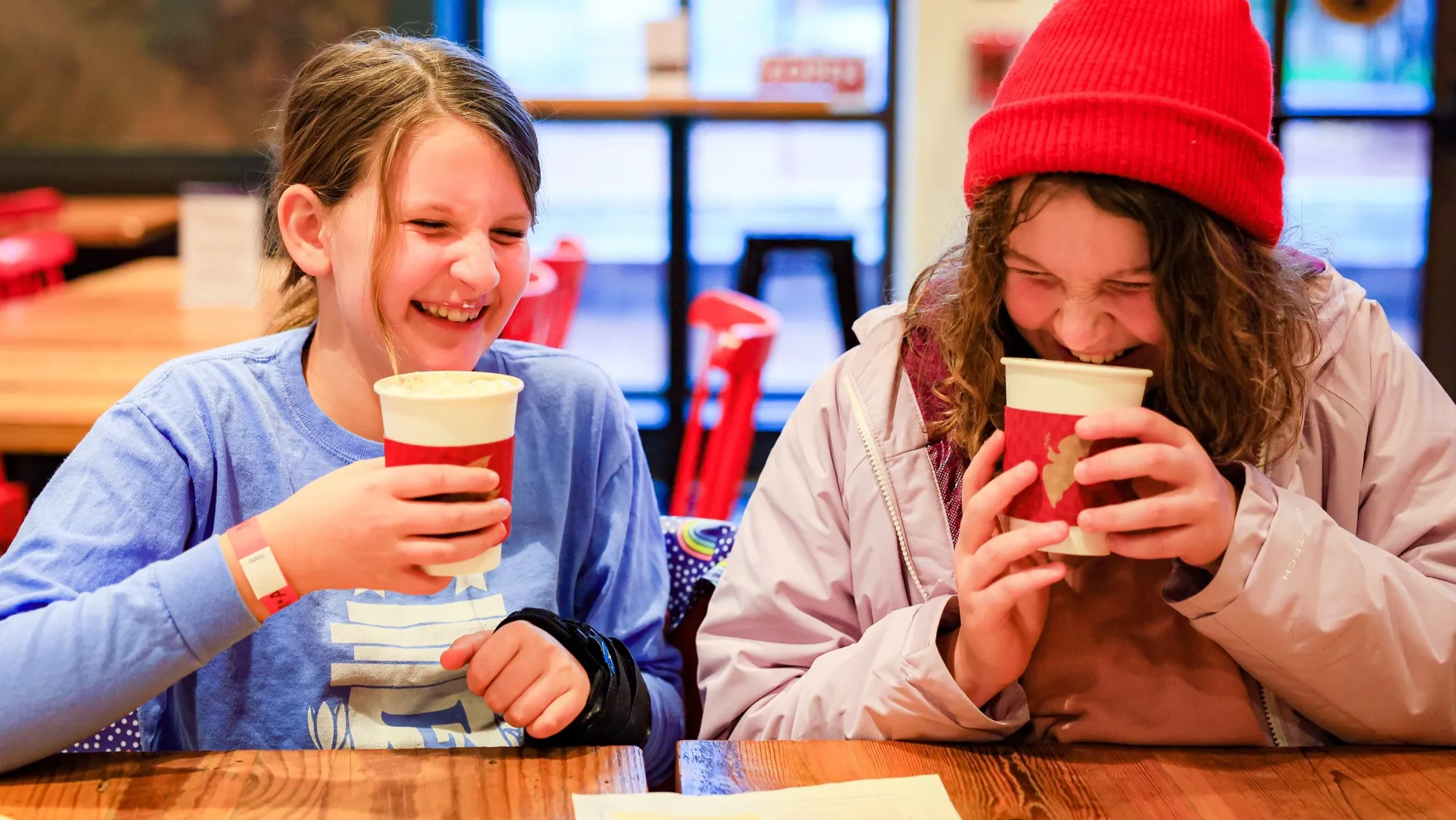 Two young visitors sip hot chocolate in the Museum's Cross Keys Cafe.