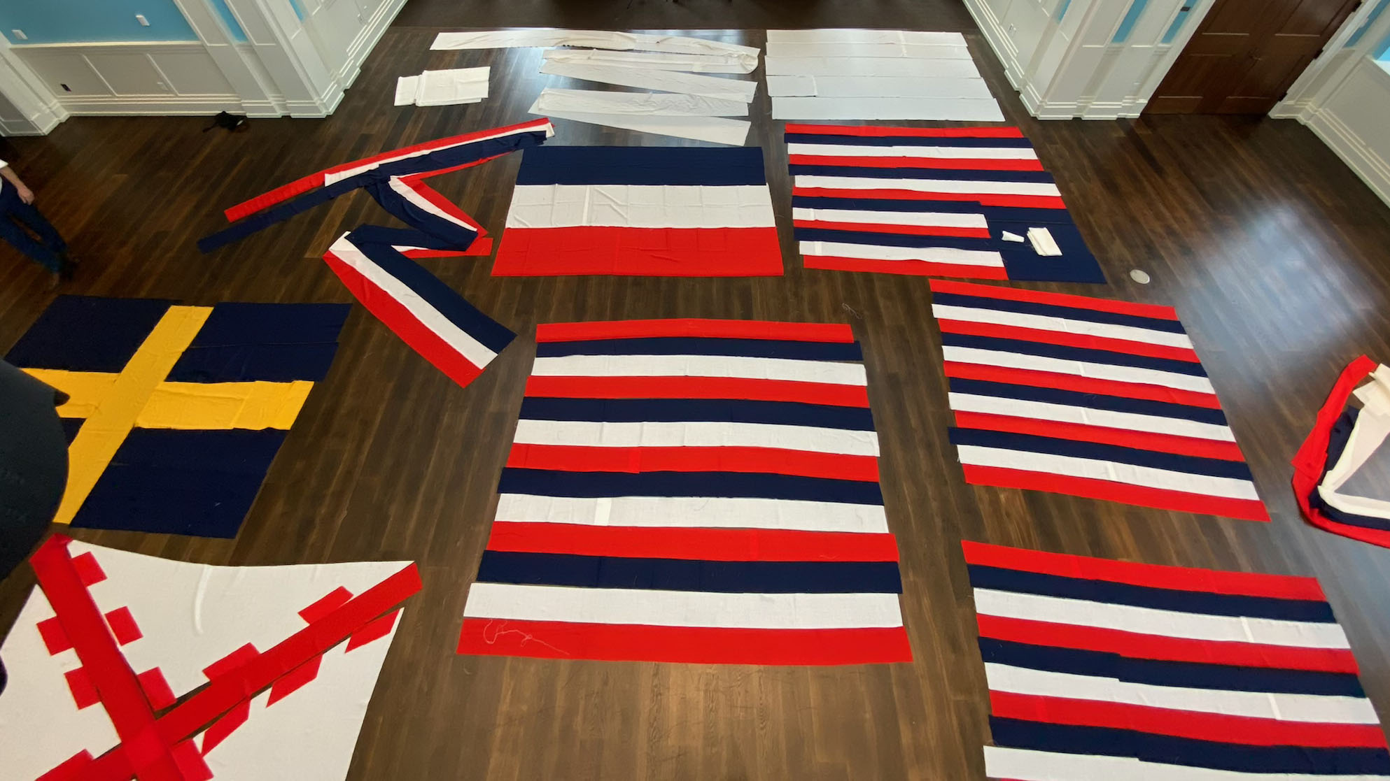 True Colours Flags laid out in liberty Hall at the Museum and photographed above from a lift