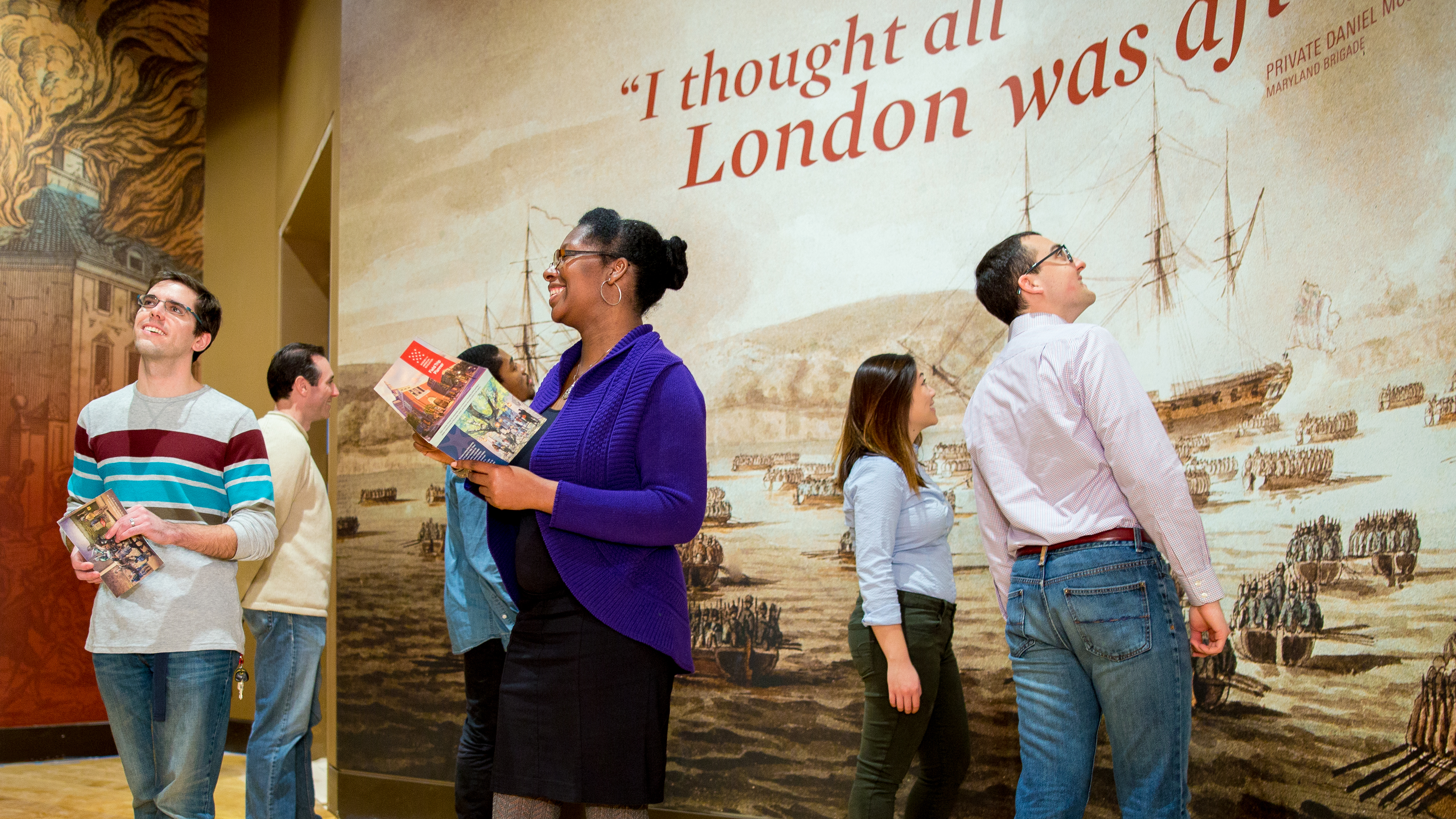 Museum guests enjoying the opening of a new exhibit.